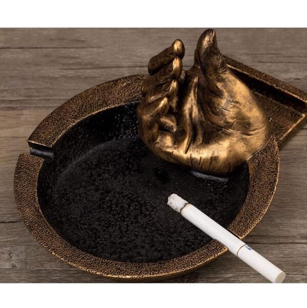 hand ashtray gold